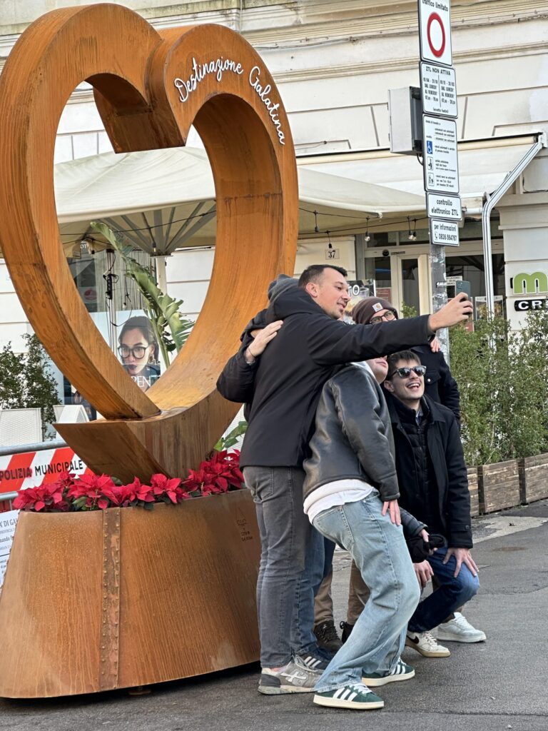 tourists in front of galatina sign