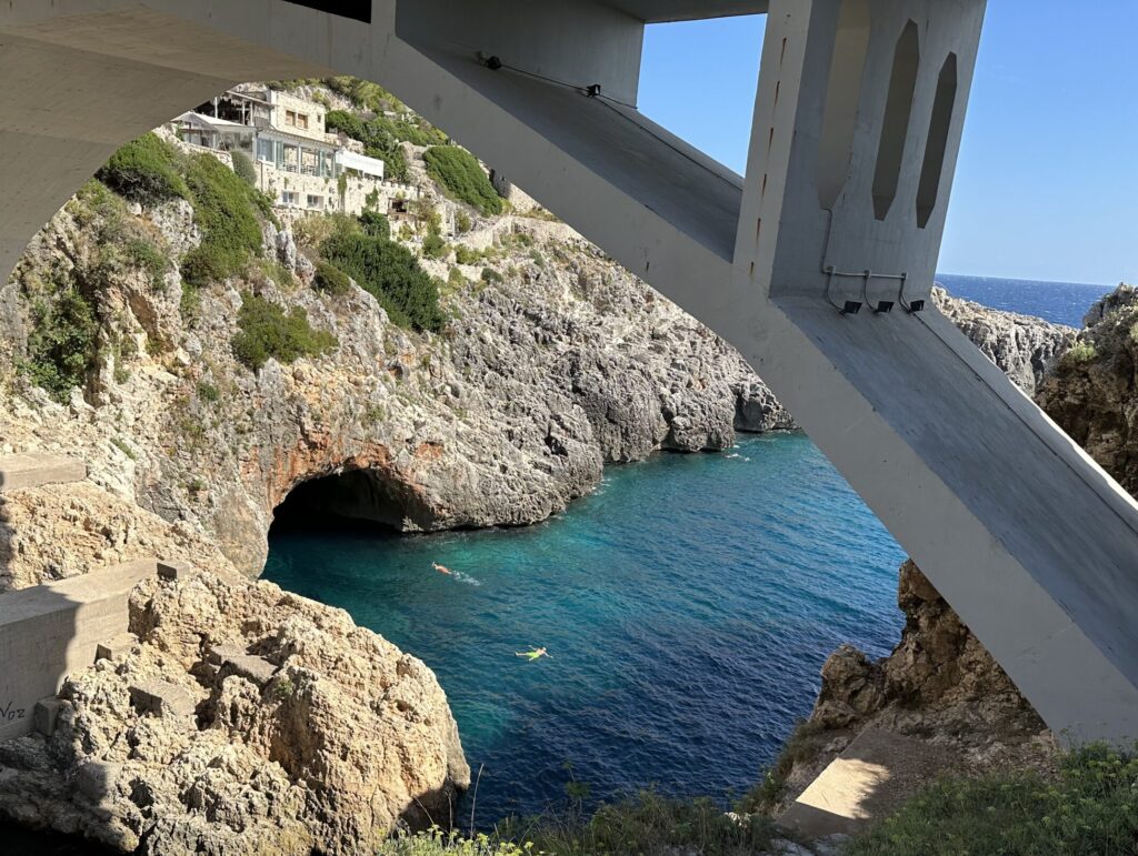 swimmers near a grotto